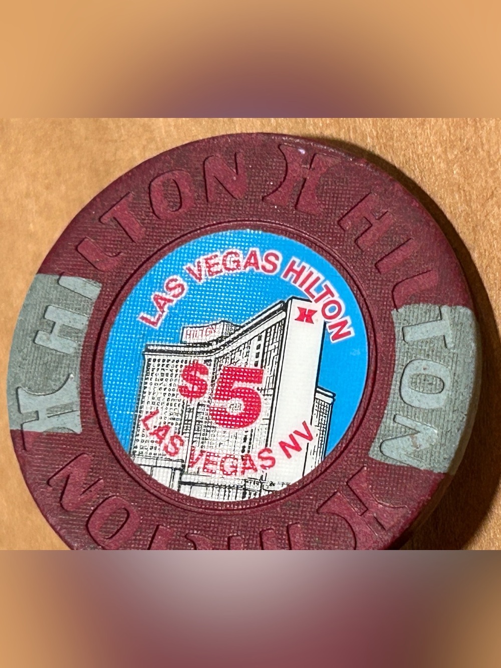 Las Vegas Hilton $5 Casino Chip - Maroon with Blue Center